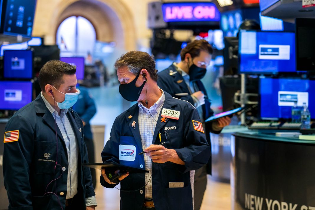 Stock futures fall as traders weigh stimulus prospects and surging Covid cases