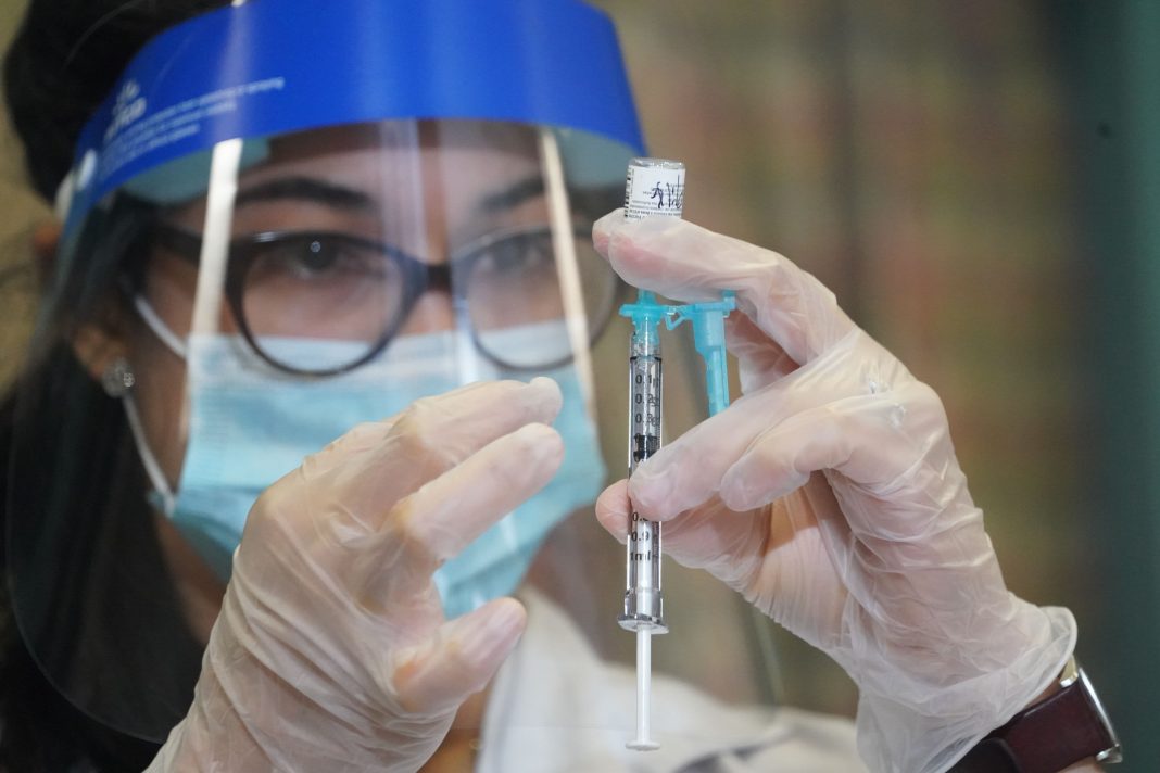 Widespread Covid vaccines will be available in the spring, says Walgreens exec