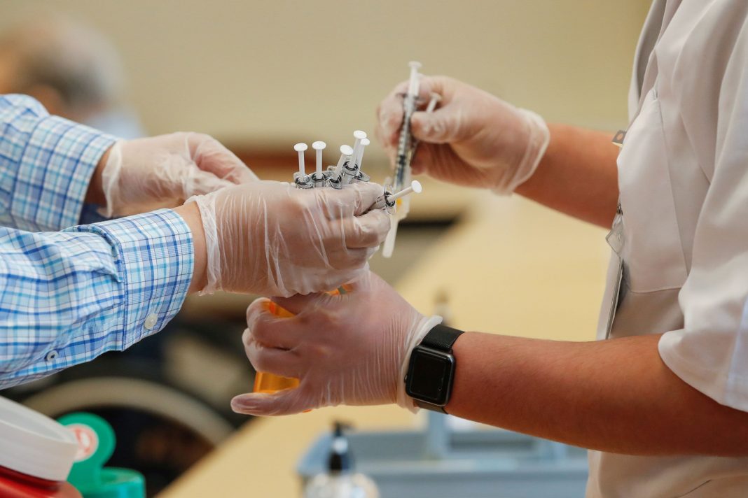 ‘Brand doesn't matter. Get the first vaccine available,' Dr. Vin Gupta says