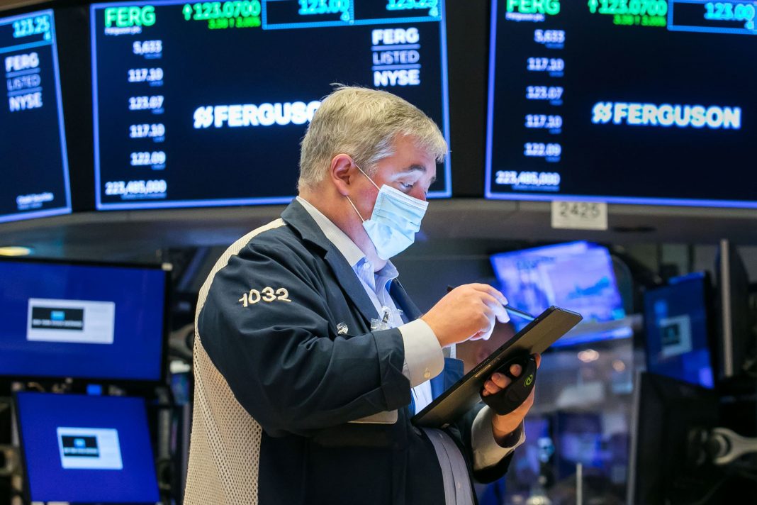 Stock futures rise slightly after Dow sets record high