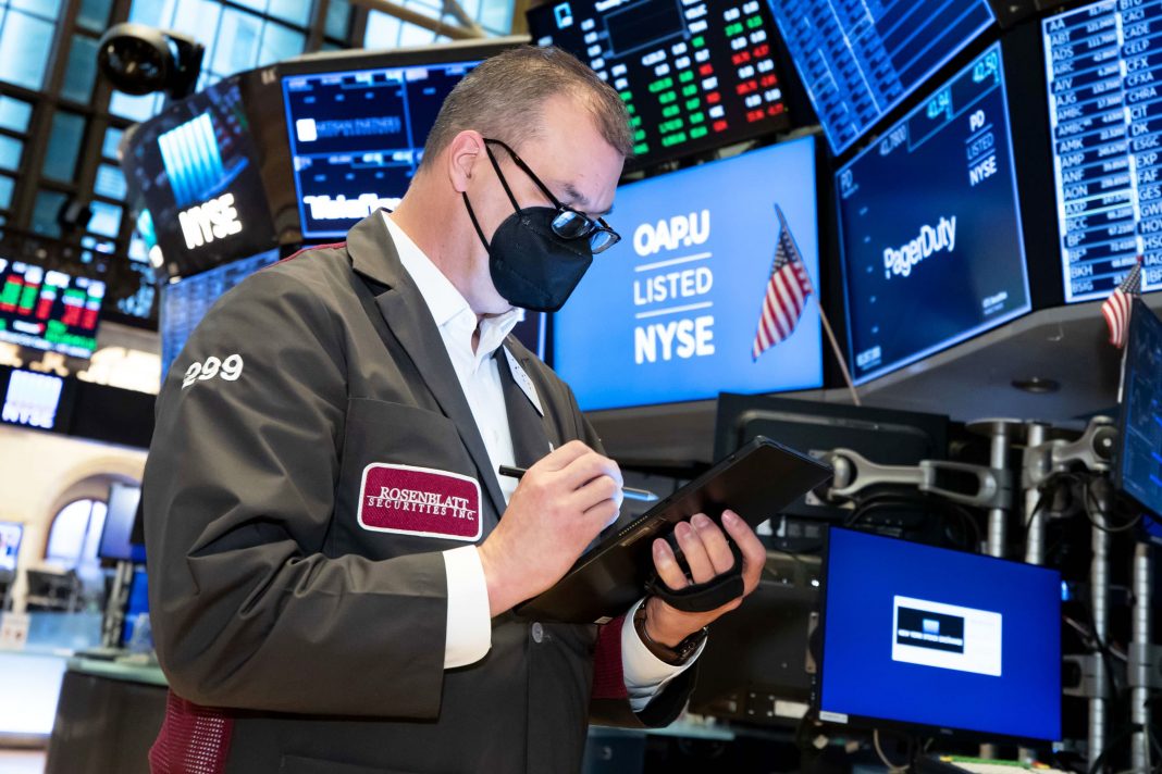 Stock futures are flat after S&P 500 and Nasdaq close at records, Tesla shares decline